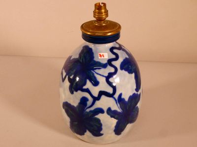 a blue and white vase with blue flowers on it