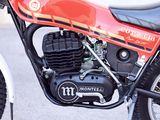 a red motorcycle parked on the side of the road