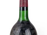 a bottle of wine that is sitting on a table