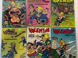 Plusieurs bandes dessinées pour enfants sont alignées sur une table