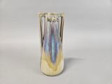 a vase that is sitting on a white surface