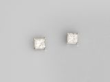 a pair of princess cut diamond stud earrings