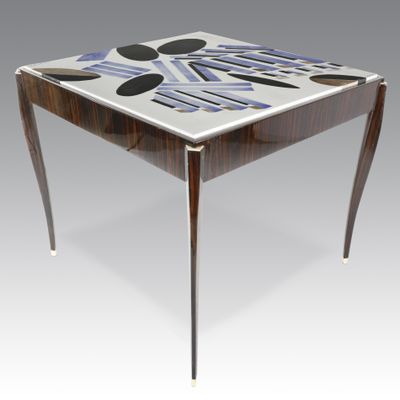 an image of a table with a glass top and metal legs
