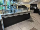 an image of a commercial kitchen with stainless steel counter tops