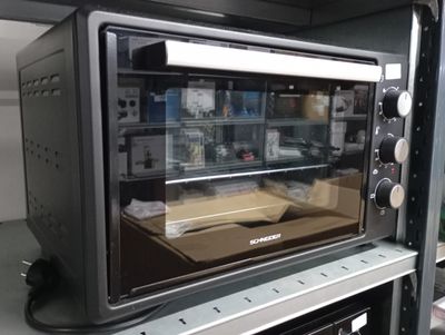 an image of a toaster oven sitting on top of a shelf