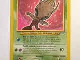 a close up of a pokemon card on a white surface