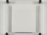 a square piece of paper on a glass plate