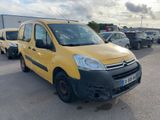 yellow citrole van parked in a parking lot next to other cars