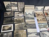 a lot of old postcards that are on a table