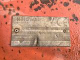 a close up of a metal plate on a rusted surface