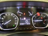 a close up of a car dashboard with various gauges
