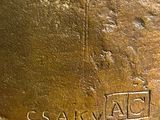 a close up of a bronze statue of a person