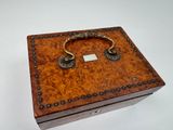 a small wooden box with a handle on it