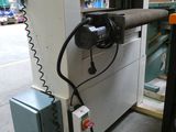 an image of a machine that is working on a piece of wood