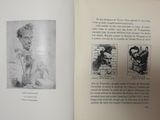 an open book with a drawing of a man and a dog