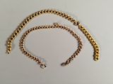 a close up of a gold chain with a clasp on it