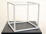 a white box that is on top of a black table
