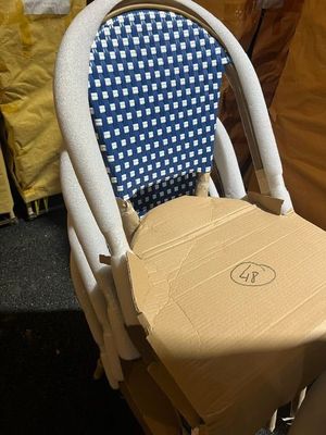 a cardboard chair with a box on the back of it