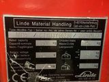 an image of a red machine with a label on it ' s side