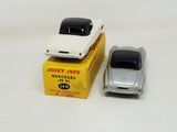 two toy cars that are sitting next to each other