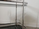 an image of a metal and glass serving cart in a room