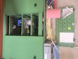 a picture of a room with a green door and a blue barrel