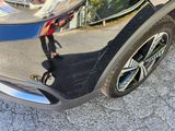 a reflection of a car on the side of the road