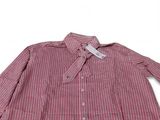 the shirt is red and white striped with a white collar