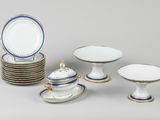 many plates and bowls that are sitting on a table