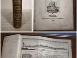 four different views of a book on a table with a map on it