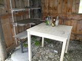 a small table with bottles on it in a room