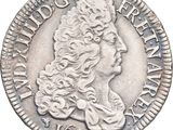 a silver coin with a woman ' s head on it