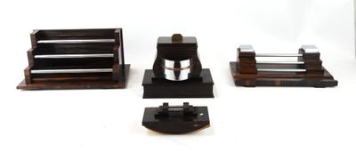 four different types of coffee grinders on a table