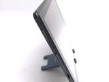 a close up of a cell phone that is on a stand