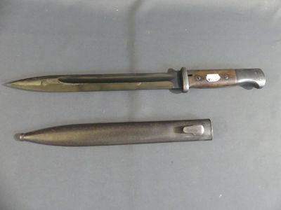 two knives that are sitting next to each other on a table