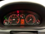 a close up of a car dashboard with various gauges