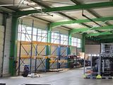an image of a large warehouse with a lot of equipment in it