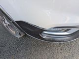 a close up of a car ' s front bumper