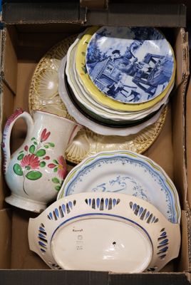 a box full of china plates and bowls in it