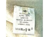 a close up of a label on a white sweater