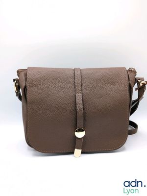 a brown leather cross body bag with a gold buckle