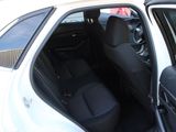 a white car with black seats in the back of it