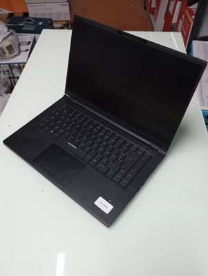 a laptop computer sitting on top of a white table