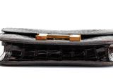 leather purse on a white background with clippings for the clasp