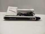 a pen that is sitting on a table next to a box