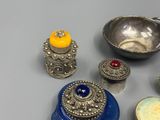 a lot of silver objects on the table together