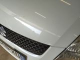 a white car that is parked in a garage
