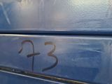 a close up of a blue bench with the number 3 on it