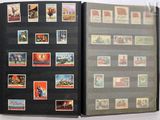 a book with stamps on the pages and a picture of a man on a motorcycle