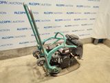 an image of a lawn mower sitting on the ground